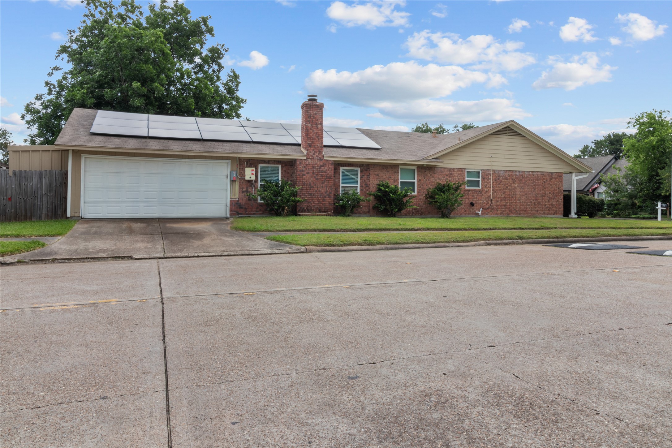 4322 Aztec Street Pasadena, TX 77504 - Photo 17 of 18 a front view of a house with a yard and garage