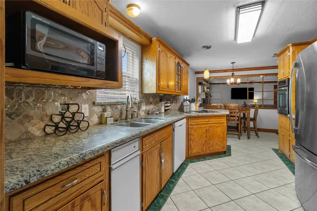 a kitchen with sink cabinets and window