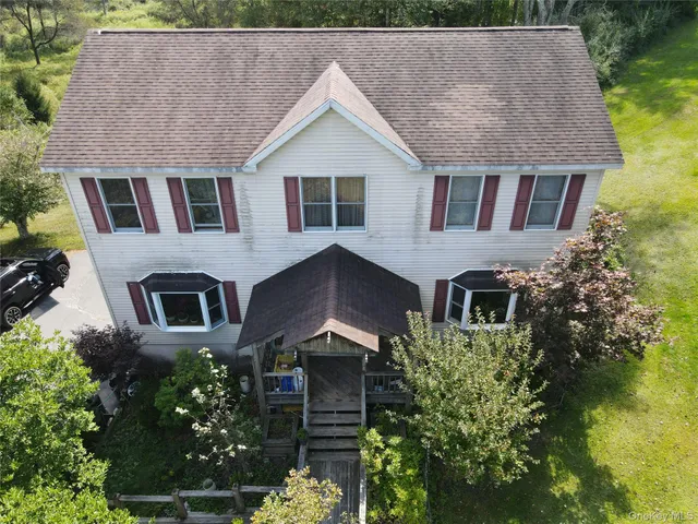 a aerial view of a house with a yard and plants