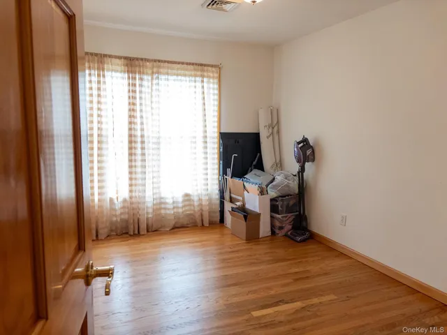 a view of a room with gym equipment and a window