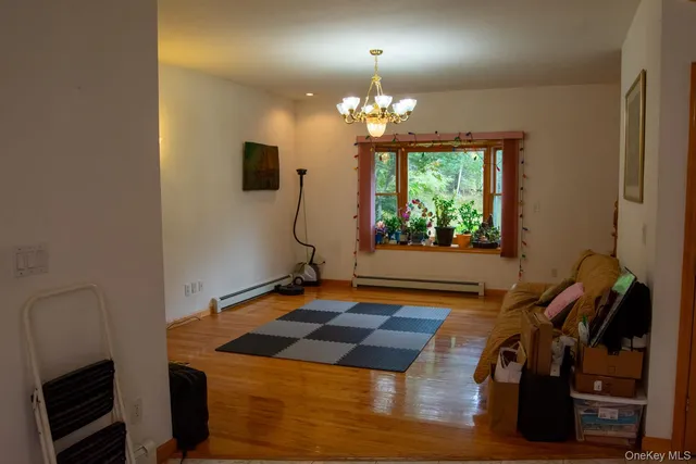 a room with gym equipment and large windows