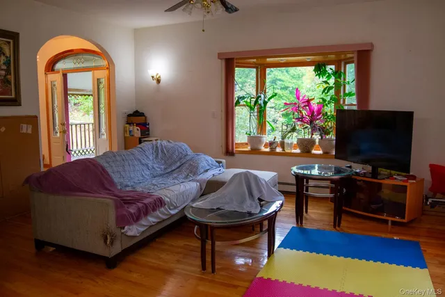 a living room with furniture and a flat screen tv