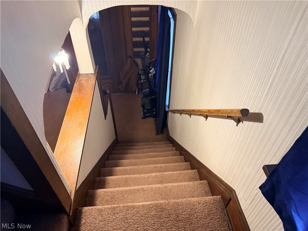 980 Brunswick Road Cleveland Heights, OH 44112 - Photo 9 of 11 Staircase featuring arched walkways