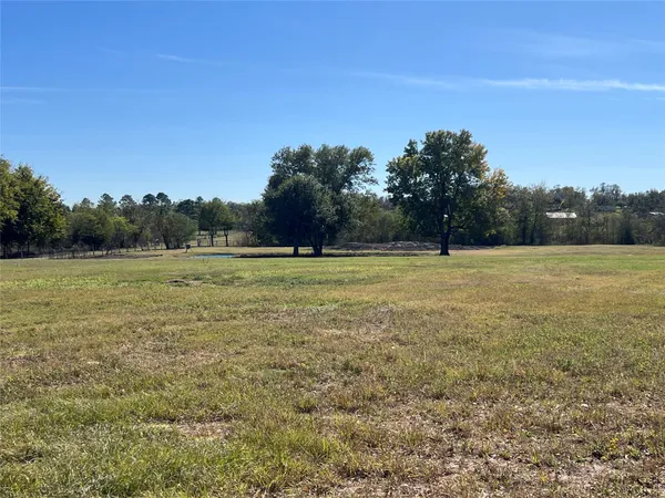 a view of a field with an outdoor space