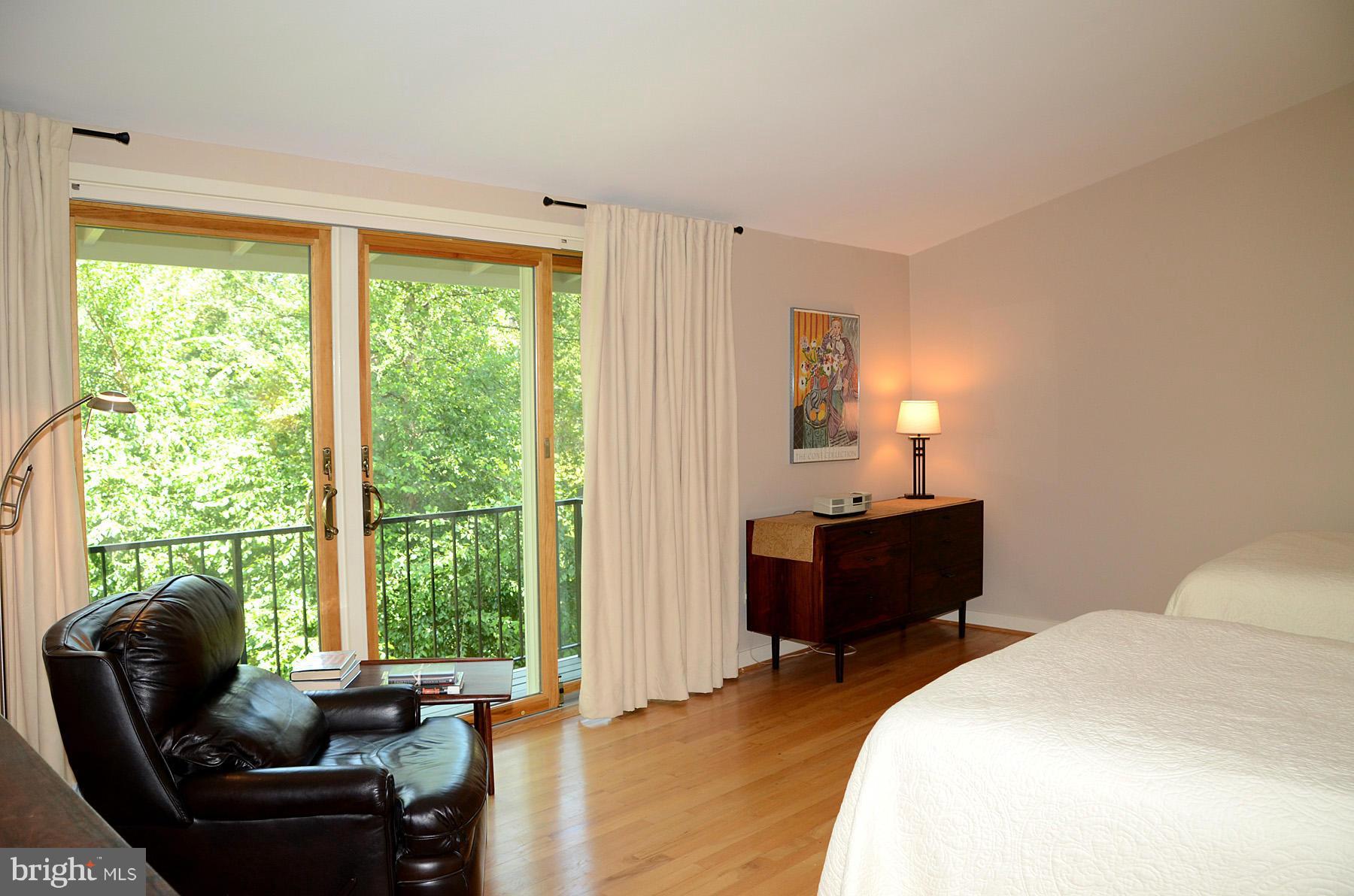 11446 Waterview Cluster Reston, VA 20190 - Photo 13 of 30 a bedroom with a bed and a couch
