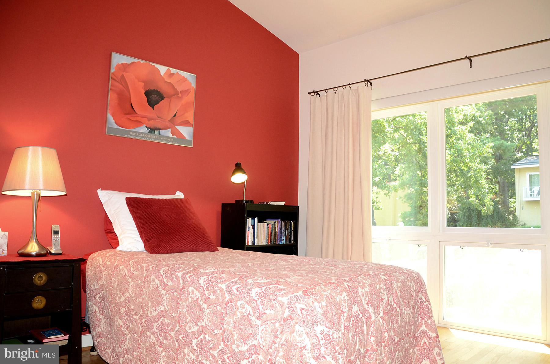 11446 Waterview Cluster Reston, VA 20190 - Photo 16 of 30 a bedroom with a bed and a window