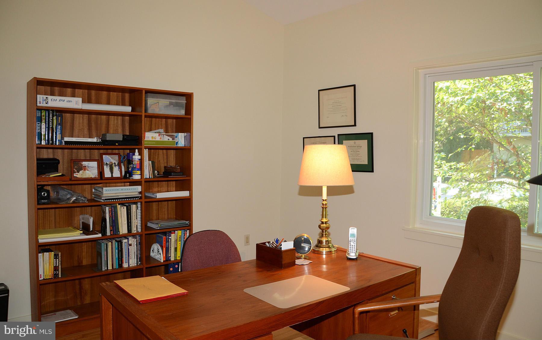 11446 Waterview Cluster Reston, VA 20190 - Photo 18 of 30 a view of a workspace with furniture and a large window