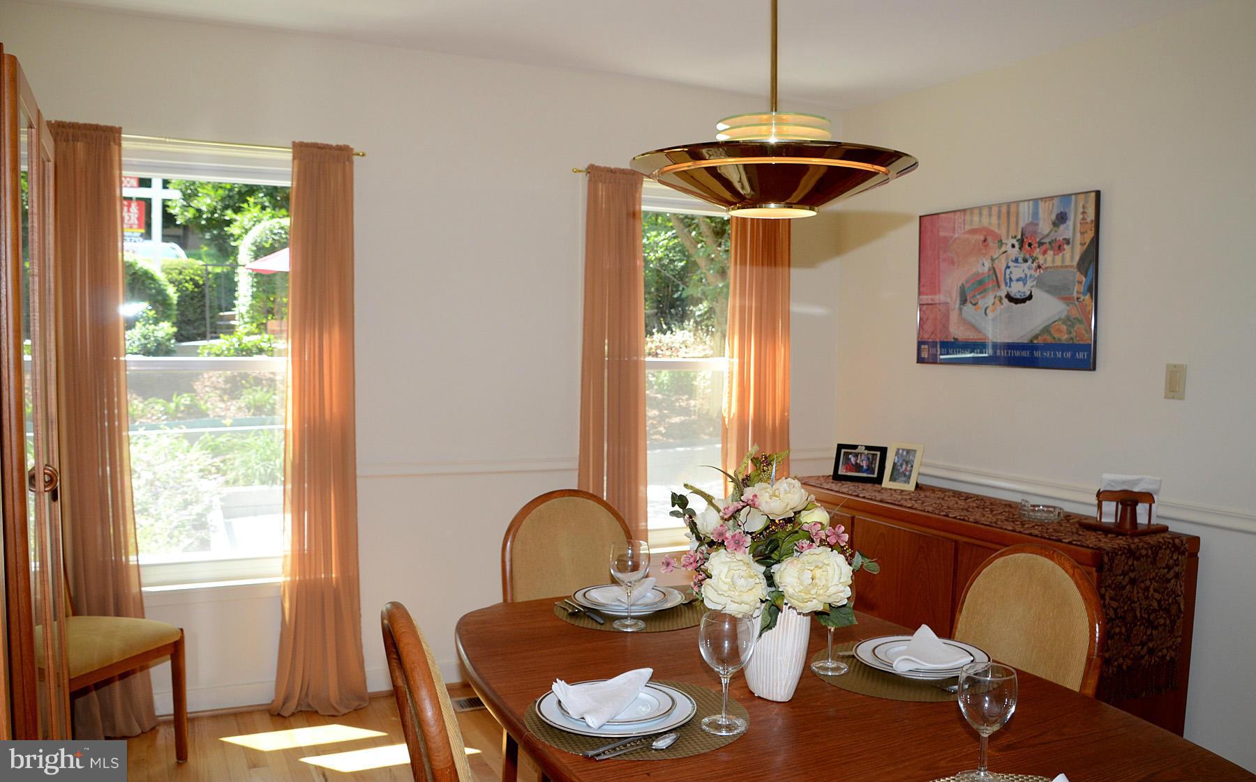 11446 Waterview Cluster Reston, VA 20190 - Photo 8 of 30 a dining room with furniture and window