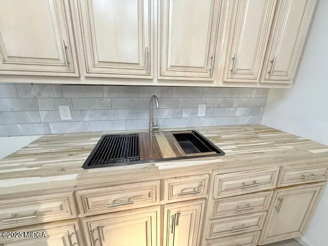 a kitchen with granite countertop white cabinets and appliances