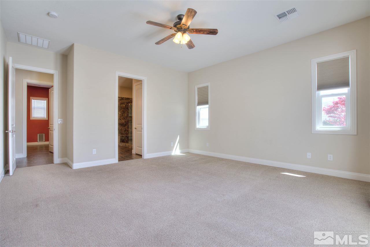 9800 Shadowless Trail Reno, NV 89521 - Photo 15 of 36 a view of empty room with ceiling fan