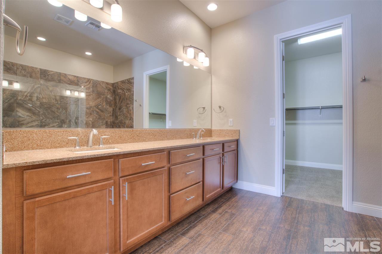 9800 Shadowless Trail Reno, NV 89521 - Photo 16 of 36 a bathroom with a double vanity sink and a mirror