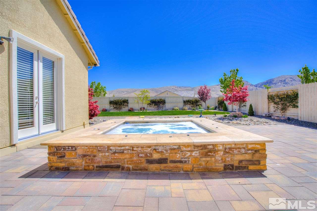 9800 Shadowless Trail Reno, NV 89521 - Photo 29 of 36 a front view of a house with a yard