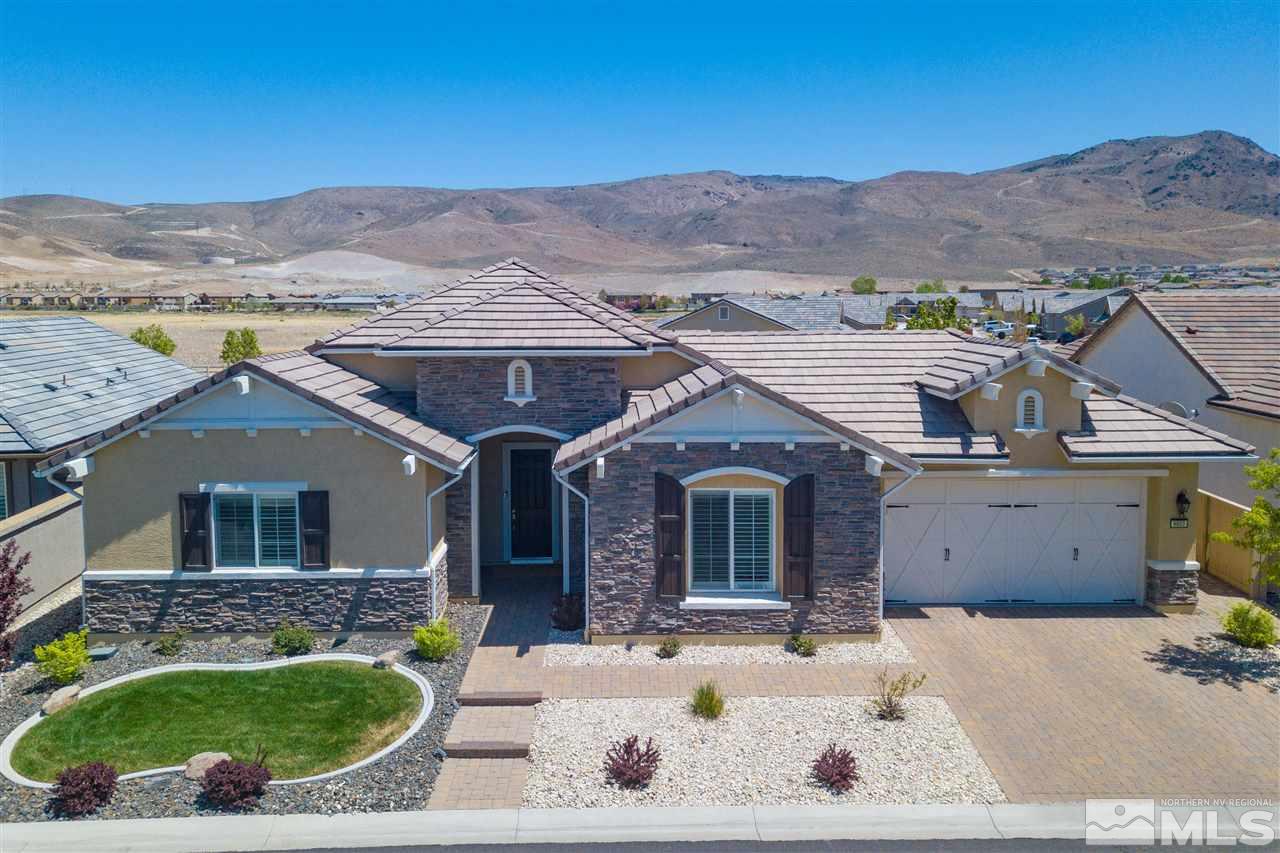 9800 Shadowless Trail Reno, NV 89521 - Photo 3 of 36 a front view of a house with a yard
