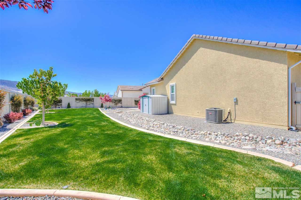 9800 Shadowless Trail Reno, NV 89521 - Photo 7 of 36 a front view of a house with a yard