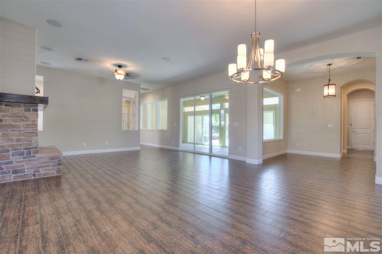 9800 Shadowless Trail Reno, NV 89521 - Photo 8 of 36 a view of a livingroom with a furniture wooden floor and chandelier