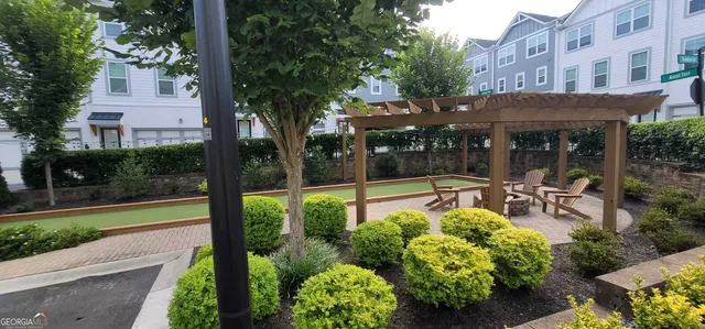 a view of a garden with patio