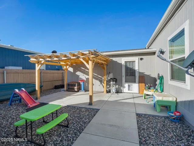 a view of house with a patio