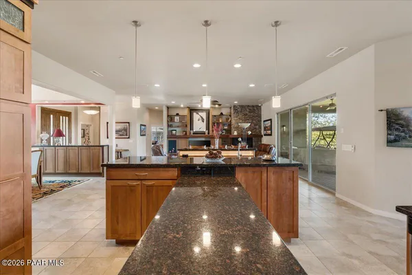 a view of a living room and kitchen