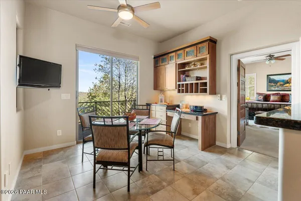 a dining room with furniture and window