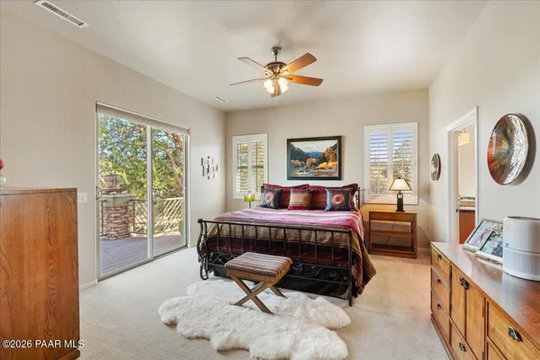 a bed room with a bed and a window