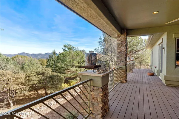 a view of a balcony with wooden floor