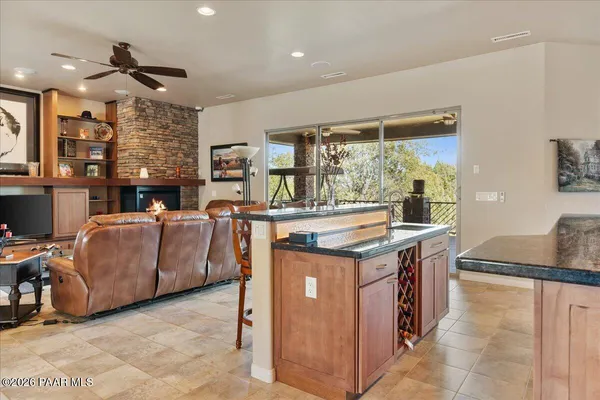 a kitchen with stainless steel appliances granite countertop a stove and a refrigerator