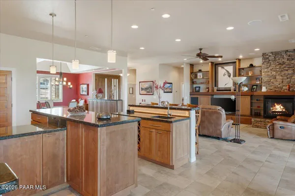 a kitchen with stainless steel appliances granite countertop a sink and cabinets
