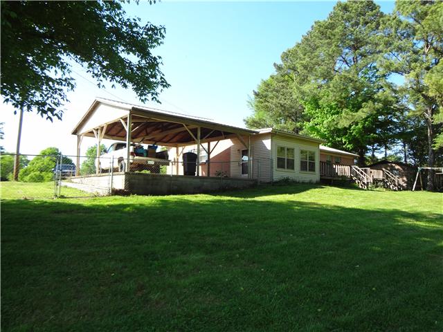 1329 Oak Grove Road Goodspring, TN 38460 - Photo 4 of 20 a front view of house with yard and outdoor seating