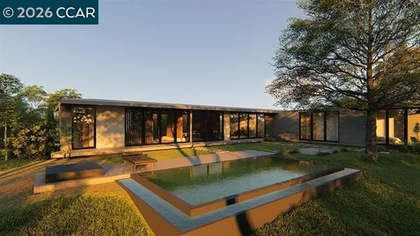 a view of a house with pool and a yard