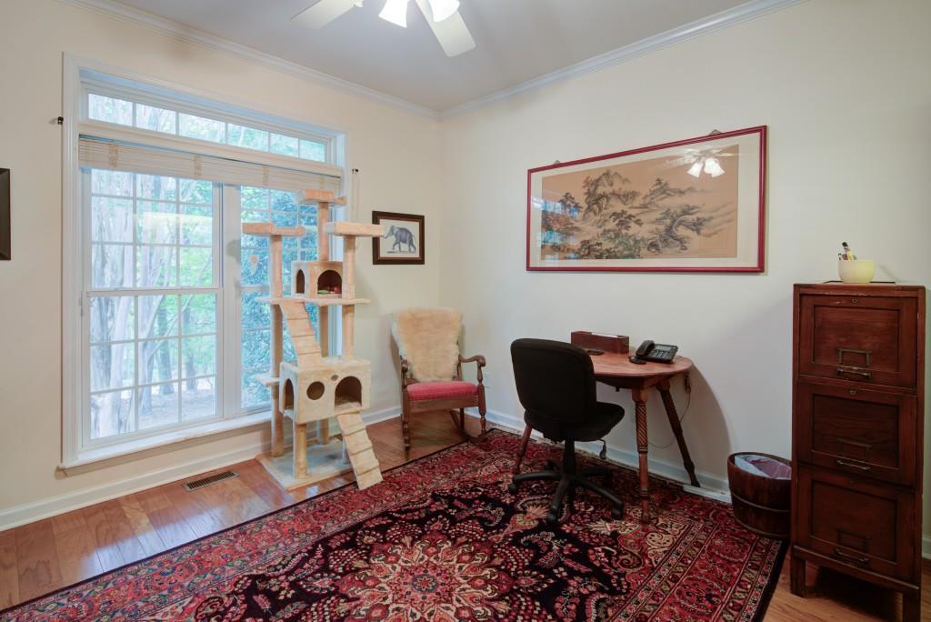 1170 Calhoun Road Dahlonega, GA 30533 - Photo 18 of 34 a living room with furniture and a window