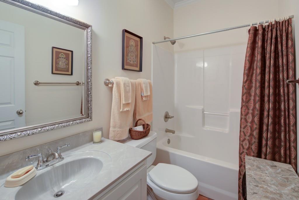 1170 Calhoun Road Dahlonega, GA 30533 - Photo 19 of 34 a bathroom with a sink toilet and shower