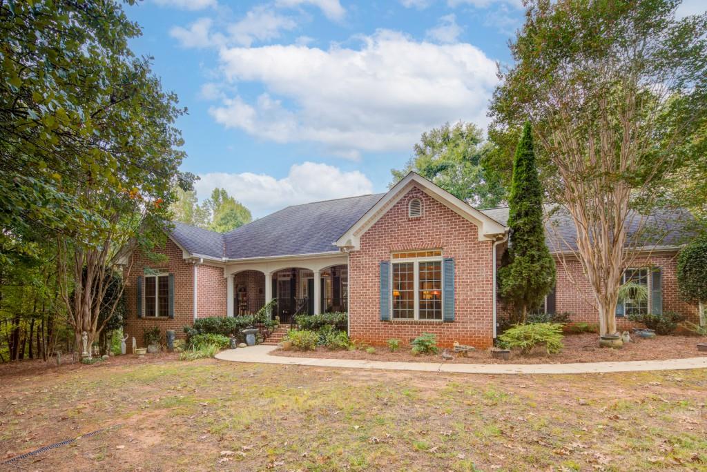 1170 Calhoun Road Dahlonega, GA 30533 - Photo 29 of 34 a front view of a house with a yard