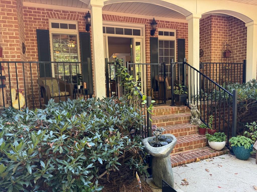 1170 Calhoun Road Dahlonega, GA 30533 - Photo 30 of 34 a view of a chair and table in the patio