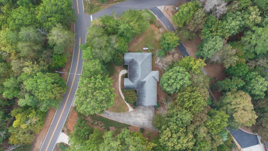 1170 Calhoun Road Dahlonega, GA 30533 - Photo 3 of 34 an aerial view of a house with a yard and garden