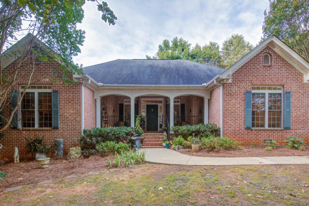 1170 Calhoun Road Dahlonega, GA 30533 - Photo 32 of 34 a front view of a house with garden