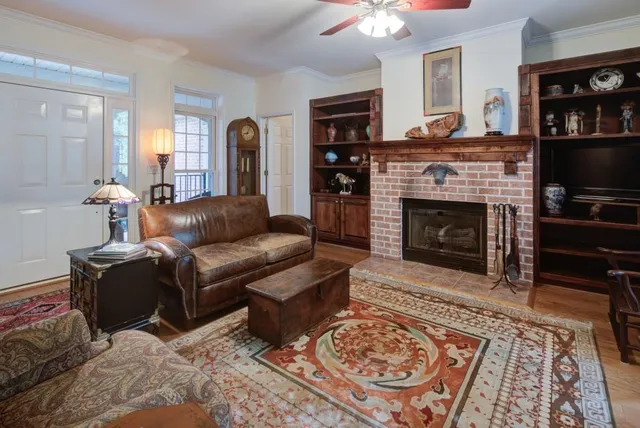a living room with furniture and a fireplace