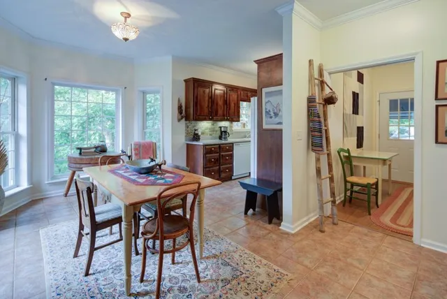 a view of a dining room with furniture window and outside view