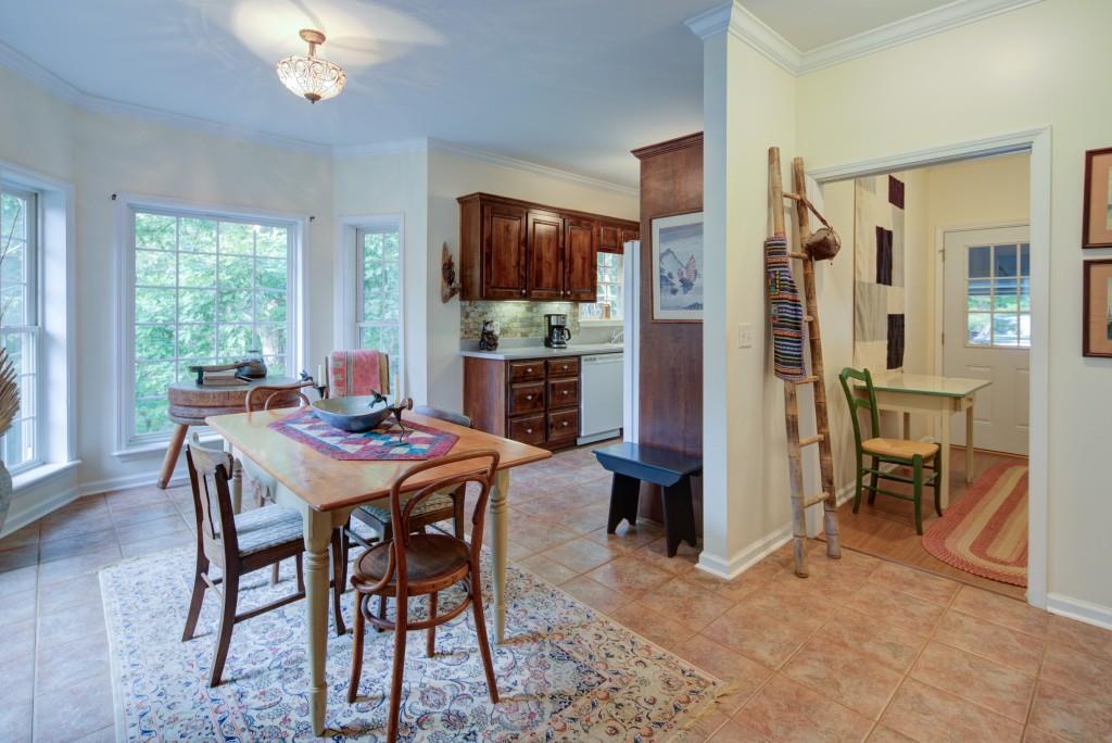 1170 Calhoun Road Dahlonega, GA 30533 - Photo 8 of 34 a view of a dining room with furniture window and outside view
