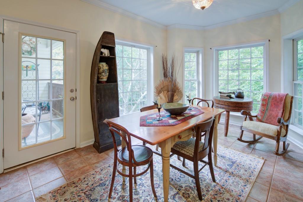 1170 Calhoun Road Dahlonega, GA 30533 - Photo 9 of 34 a view of a dining room with furniture and a large window