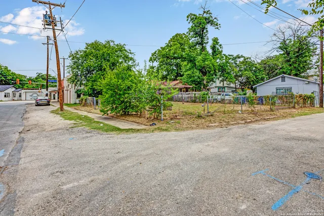 a view of backyard with a road sign board