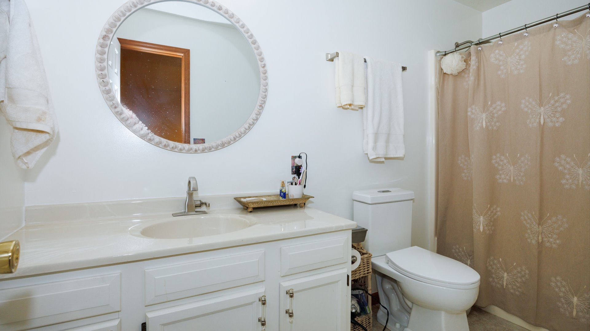 67 Oak Park Road Bloomington, IL 61701 - Photo 16 of 34 a bathroom with a sink a toilet and a mirror