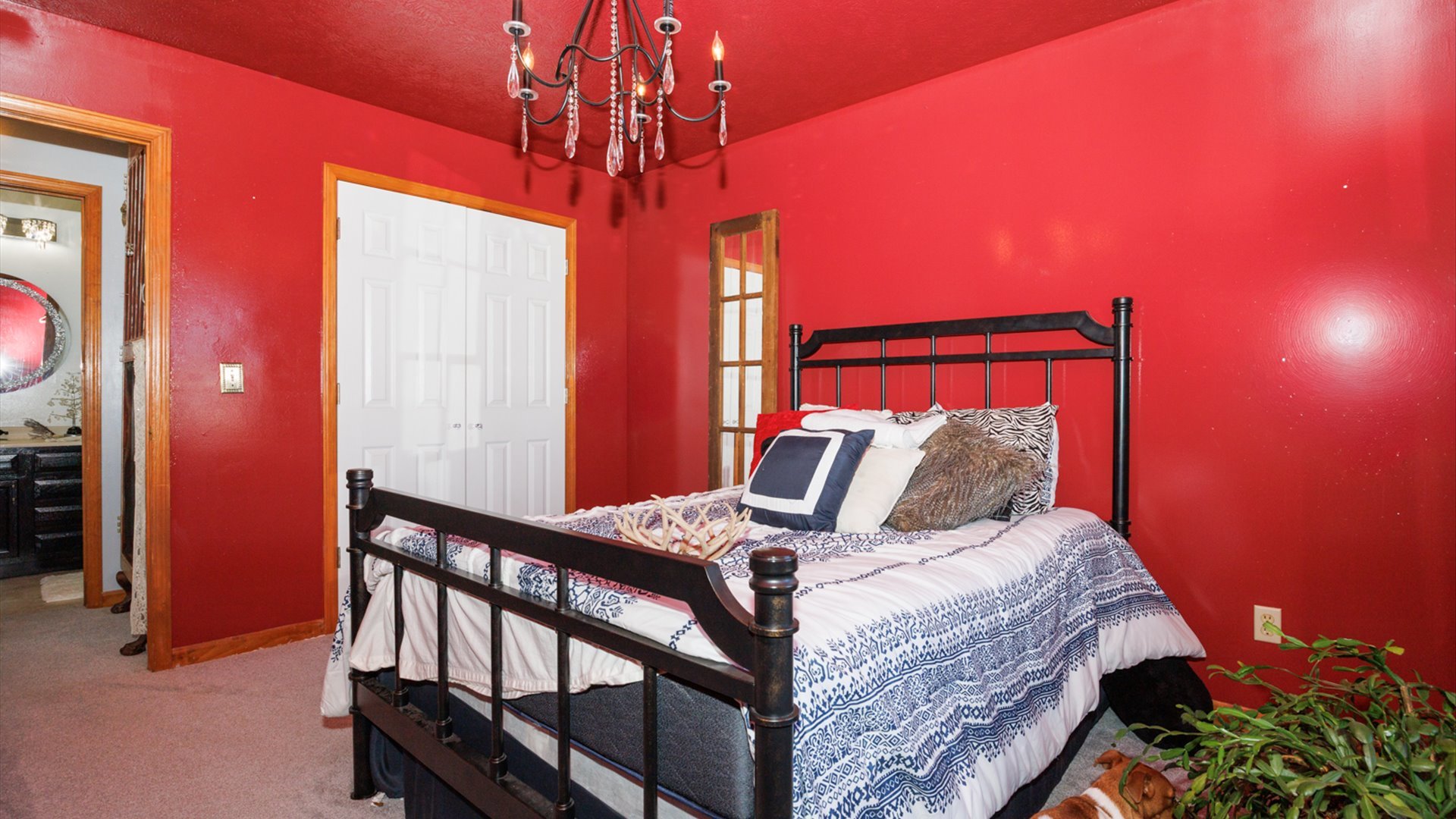 67 Oak Park Road Bloomington, IL 61701 - Photo 19 of 34 a bed sitting in a bedroom next to a window