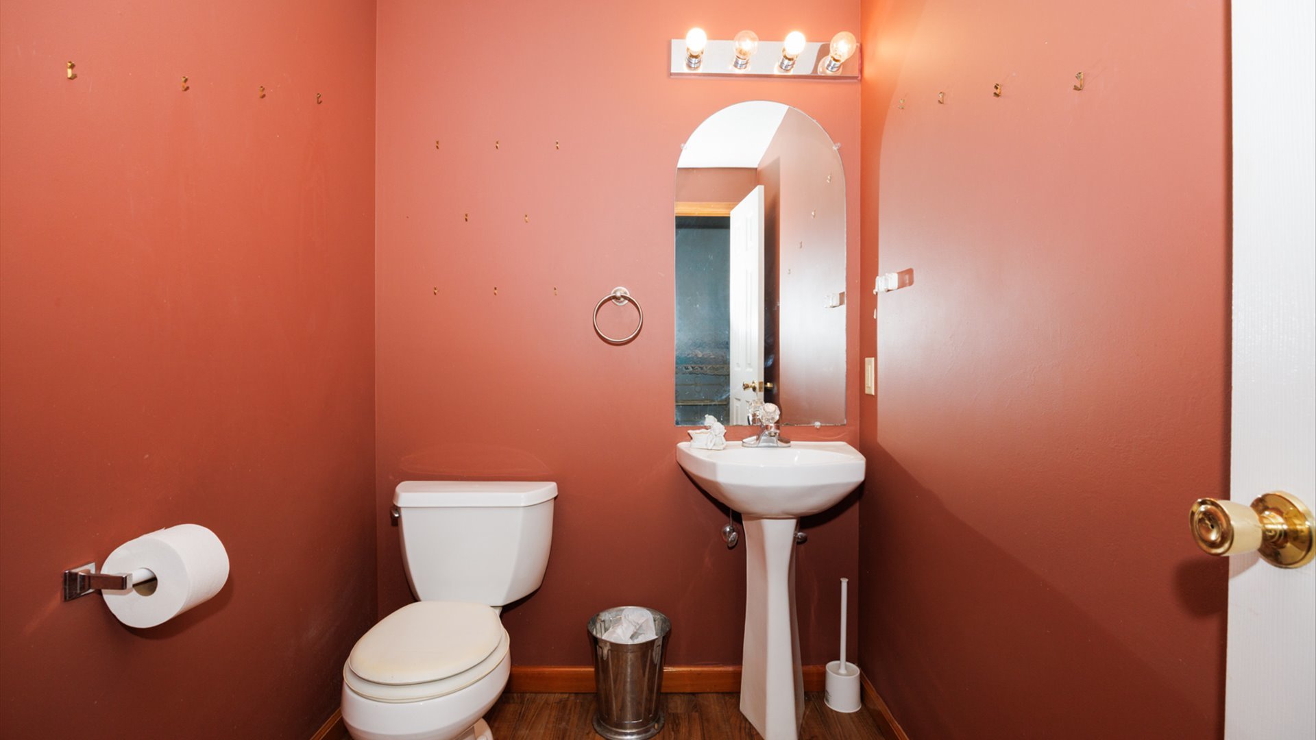 67 Oak Park Road Bloomington, IL 61701 - Photo 21 of 34 a bathroom with a toilet sink and mirror