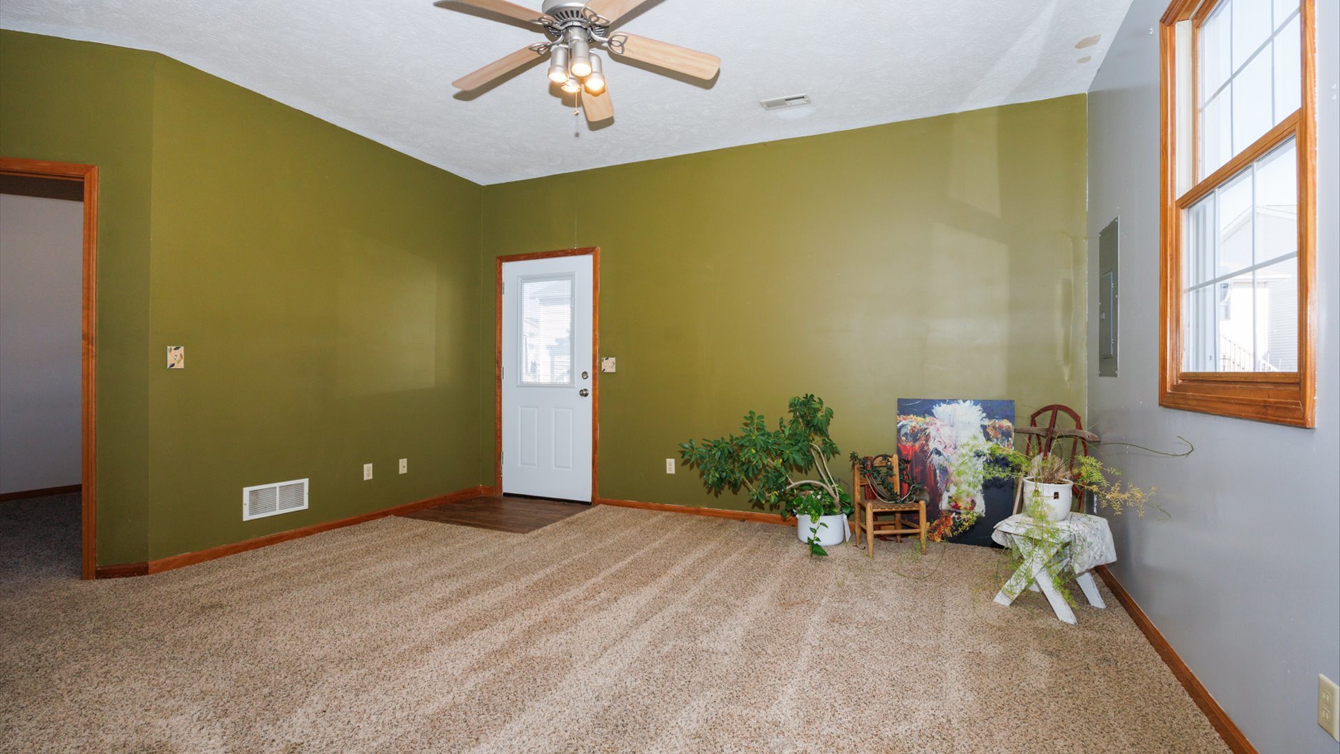 67 Oak Park Road Bloomington, IL 61701 - Photo 22 of 34 a view of a livingroom with a chandelier furniture and windows