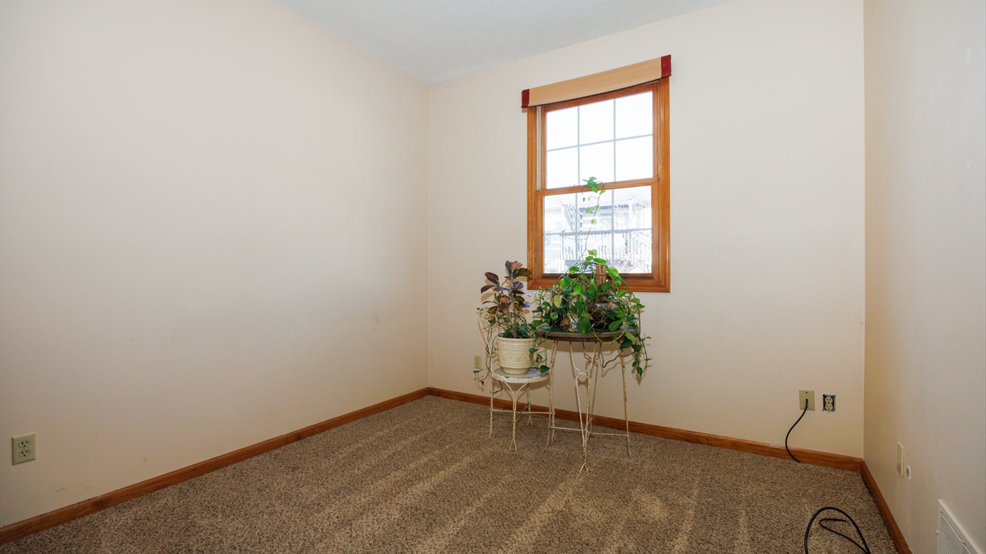 67 Oak Park Road Bloomington, IL 61701 - Photo 26 of 34 a view of an empty room with a window