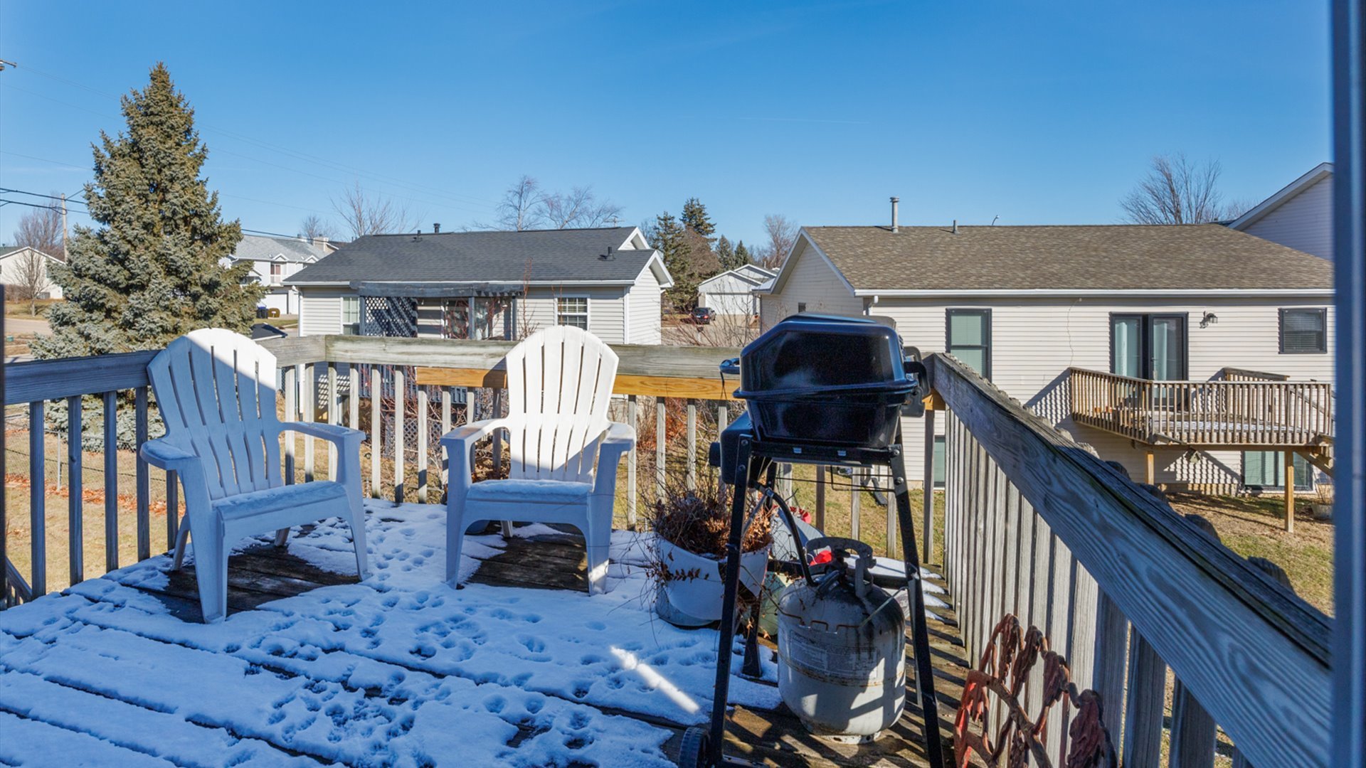67 Oak Park Road Bloomington, IL 61701 - Photo 32 of 34 a view of a house with large wooden deck