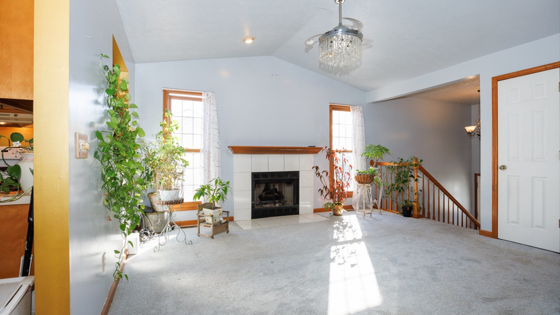 67 Oak Park Road Bloomington, IL 61701 - Photo 7 of 34 a living room with furniture and a fireplace