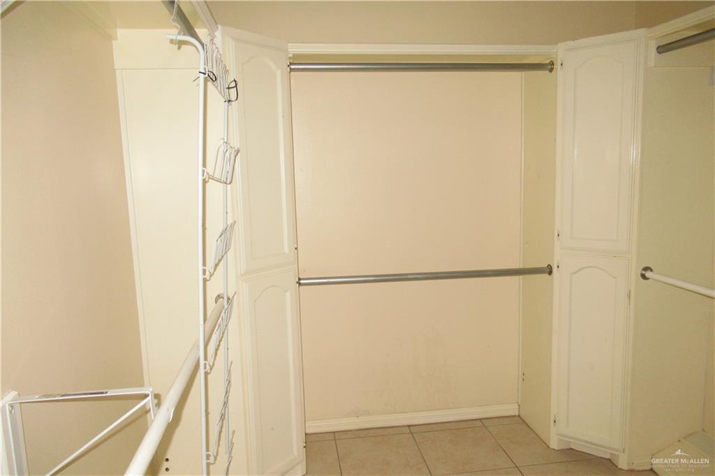 3307 Santa Teresa Mission, TX 78572 - Photo 19 of 33 a view of a closet with wooden floor