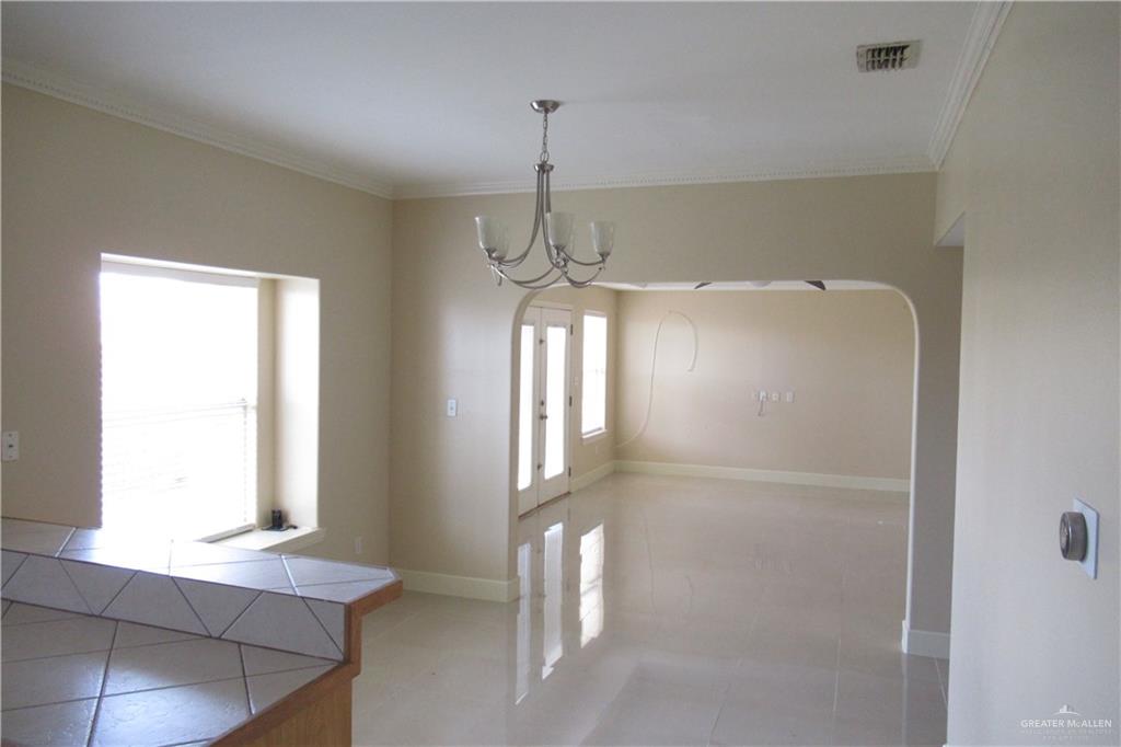 3307 Santa Teresa Mission, TX 78572 - Photo 5 of 33 a room with window and a chandelier