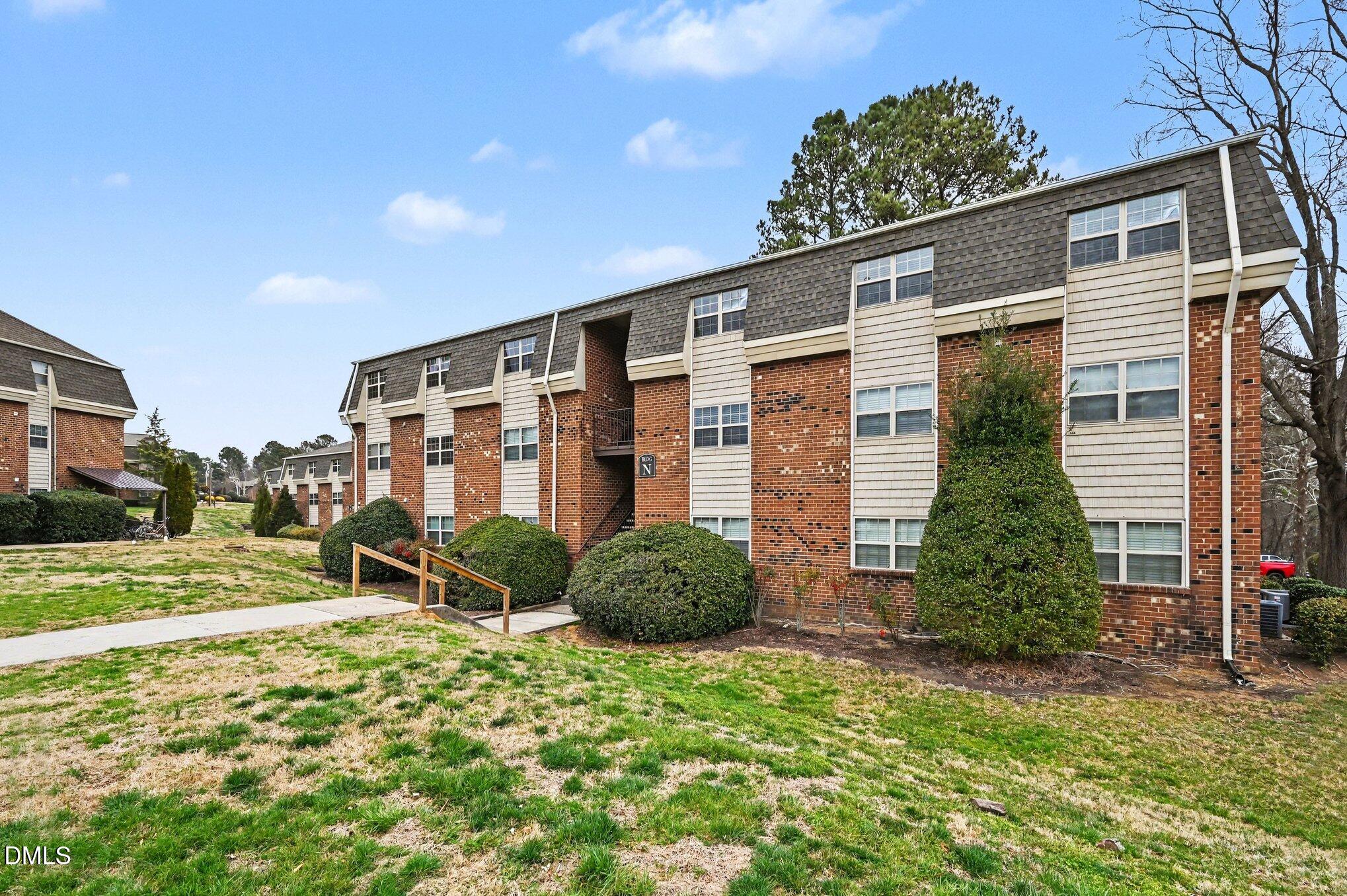 501 Jones Ferry Road, Unit N9 Carrboro, NC 27510 - Photo 2 of 22 a front view of a house with garden